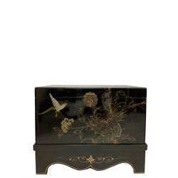 Black lacquered chest on a stand