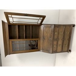 Early 20th century oak bureau bookcase, lunette carved frieze over two tracery glazed doors enclosing three shelves, fall front under revealing fitted interior, two short and two long drawers to base, turned supports 