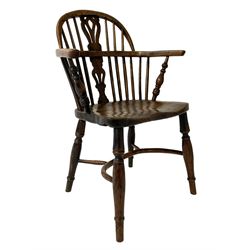 Early 19th century elm and yew wood Windsor armchair, low stick back with pierced splat, dished seat on turned supports joined by crinoline stretcher