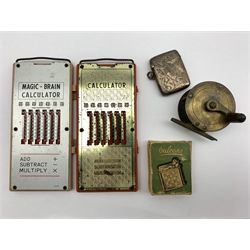  Victorian silver vesta case by William J Holmes, Birmingham, 1886, brass fly reel, Vulcano lighter in original box and two 'Magic-Brain' Calculators (5)  