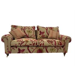 Duresta - two seat sofa upholstered in embossed floral fabric with footstool 