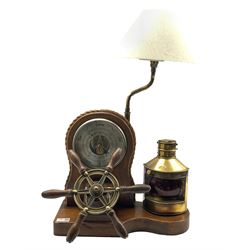 Nautical themed table top lamp and aneroid barometer, the oak case with novelty ships wheel and gas lamp, W42cm