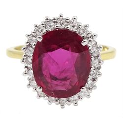 18ct gold oval ruby and round brilliant cut diamond cluster ring, hallmarked, ruby 3.85 carat, total diamond weight approx 0.55 carat, with The Gem & Pearl Laboratory Report
