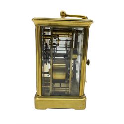 Late 19thth century twin train Corniche striking carriage clock striking the hours on a coiled gong, eight-day movement with a jewelled lever platform escapement and balance timing screws, white enamel dial with Roman numerals, minute markers and steel moon hands, bevelled glass panels to the case and an oval glass panel to the top of the case, with original base plate. 
With Key.

