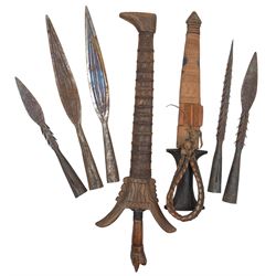 Indonesian Kris with waved steel blade with carved animal head grip and wooden scabbard, dagger in leather sheath and five fishing spear heads (7) 