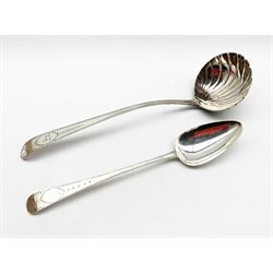 George III Irish silver ladle with bright cut stem and scalloped bowl by James Keating, Dublin and a basting spoon engraved to match by William Ward Dublin 1801 with a crest possibly of the Trotter family 12.4oz