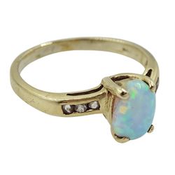 9ct gold single stone oval opal ring with cubic zirconia set shoulders, hallmarked 