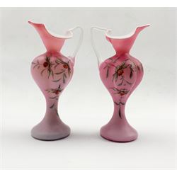 Pair of 19th/ early 20th century pink satin glass ewers painted with floral sprays, H24cm 