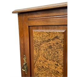 Edwardian walnut bedside cabinet, moulded top with arched back, enclosed by single door with figured panel, on bracket feet