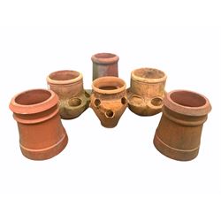 Pair of terracotta strawberry planters, together with another terracotta strawberry plant pot and three other terracotta items 