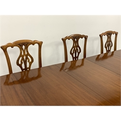 Early 20th century mahogany dining table, oval gadroon carved telescopic extending top with four additional leaves and winder, acanthus carved cabriole supports with ball and claw feet (H76cm, 137cm x 162cm - 360cm, 11' 10'' (extended)), and set eight (2+6) Chippendale design dining chairs, shaped cresting rail over pierced and carved splat, upholstered drop in seat, on ball and claw cabriole supports