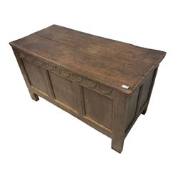 18th century oak coffer or chest, rectangular hinged two-plank top with moulded edge, the frieze carved with lunette C-scrolls over triple panelled front, raised on stile supports