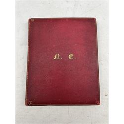 Late Victorian sketch book inscribed N Crawley, Islington with sketches, verse, photographs, calligraphy etc with red leather boards with gilt lettering