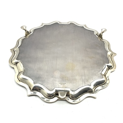 Silver circular salver with pie crust border, presentation inscription and on triple shaped supports D30cm Birmingham 1928 Maker Ellis & Co 26oz