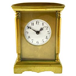 French - late19th century spring driven 8-day table clock, with four bevelled glass panels, brass case with a convex top and shaped stepped base, gilt dial mask and circular white enamel dial with upright Arabic’s and minute markers,  non-matching fleur de Lis hands, eight-day spring driven movement with rack striking, sounding the hours and half-hours on a coiled gong, with a jewelled lever platform escapement, balance with regulation and timing screws, original baseplate cover, movement backplate stamped “Made in France” with key