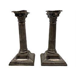 Pair of Edwardian silver Corinthian column candlesticks, hallmarked Thomas Bradbury & Sons Ltd, Sheffield, 1905, H18cm