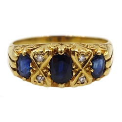  18ct gold three stone oval sapphire and four stone diamond ring, London 1974  