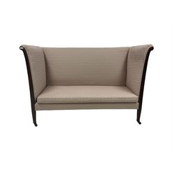 High back settee, upholstered in ivory and pink fabric, raised on square supports, terminating in brass castors 