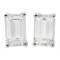 Pair of 18ct white gold emerald cut diamond stud earrings, hallmarked, diamond total weight 1.8 carat