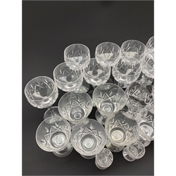 Part suite of Stuart crystal drinking glasses comprising fourteen hock glasses, twelve various shaped claret glasses and four sherry glasses 