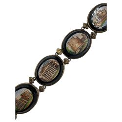 19th century Grand Tour micro mosaic bracelet composed of six oval panels depicting Roman Architecture, including The Colosseum, Parthenon, Temple of Hercules and other buildings, each set within an oval onyx and white metal surrounds, each mount interspersed with two embossed white metal flowerheads attached to a double row chain and push clasp, L19.5cm, largest panel 3cm x 2.5cm