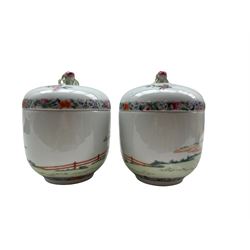 Pair of Chinese Republic Period porcelain bowls and covers, each similarly painted with a procession of boys holding objects and musical instruments in a garden setting, the fitted dome cover with double peach-form knop, iron red Qianlong Nian Zhi marks beneath, D11.5cm x H15.5cm