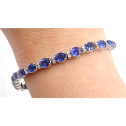 18ct white gold oval sapphire and round brilliant cut diamond bracelet, stamped 750, total sapphire weight approx 12.00 carat
