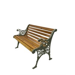 Garden bench, the slatted seat and back with green painted iron ends 