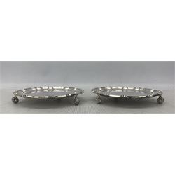 Pair of modern silver circular card trays with pie crust borders and scroll feet, one with inscription D15cm London 2005, Rippleglen sponsors mark
