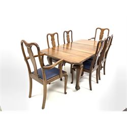 Early 20th century oak extending dining table, the rectangular top with one additional leaf, raised on cabriole supports, with original winding handle (185cm x 102cm H76cm extended) together with a set of six (4+2) early 20th century oak dining chairs, shaped cresting rail, splat back, drop in vinyl upholstered seat pads, raised on cabriole supports (W51cm)