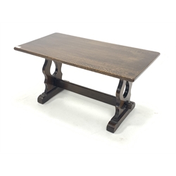 Rectangular oak coffee table, with pierced and shaped panel end supports with sledge feet, united by pegged stretcher 90cm x 47cm, H46cm