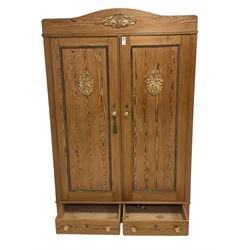 Late 19th century pitch pine double wardrobe, enclosed by two panelled doors, two drawers to base 
