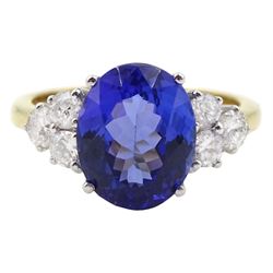 18ct gold oval tanzanite ring, each side set with three round brilliant cut diamonds, hallmarked, tanzanite approx 4.10 carat, total diamond weight approx 0.50 carat