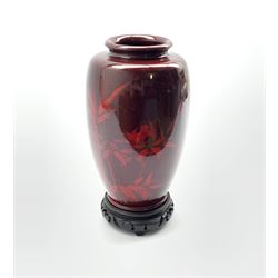 Oriental red lacquer vase decorated with bamboo and a bird on hardwood stand, H25cm 