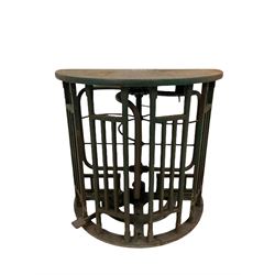 A cast iron turnstile from York City football ground by Ellison & Co., Manchester, painted green with crowed counter with brass plate H104cm, W110cm, D104cm 