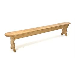 20th century pine bench raised on shaped panel end supports
