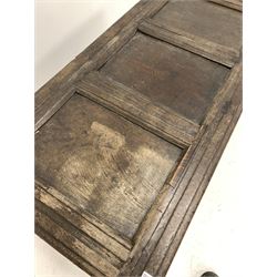 Late 17th/ Early 18th century oak coffer, the panelled top lifting to reveal plain interior over lunette carved frieze and three panels, raised on stile supports W110cm