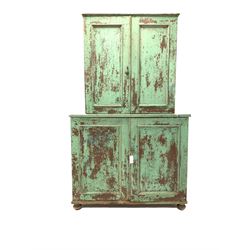 19th century stained and painted pine country kitchen press, the top section fitted with two panelled doors enclosing three shelves, two panelled doors enclosing two shelves under, raised on compressed bun supports W109cm, H186cm, D47cm