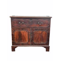 Georgian mahogany secretaire, the pierced brass galleried top over pull out fall front drawer revealing fitted interior, two panelled cupboards to base with brass inlay, raised on bracket supports W119cm