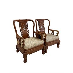 Pair Chinese hardwood armchairs, the backs with mother of pearl inlays depicting naturalistic scenes, decorated with carved and pierced scroll work, the supports carved with dragons and scrolled terminals (W69cm, H101cm, D69cm), together with matching lamp or side table, inlaid with floral decoration (57cm x 52cm, H59cm)
