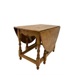 Pollard oak gate leg table by - D Shackleton of Snainton, the drop leaf oval top over gate leg action, raised on turned and square supports W64cm