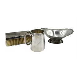Small silver christening mug engraved with initials and with loop handle H8cm Birmingham 1915 Maker William Aitken, silver oval pedestal dish with floral border L16cm Birmingham 1970 and a silver gentleman's silver backed hair brush, 7.7oz weighable silver