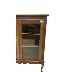 Early 20th century hardwood display cabinet, egg and dart cornice over two glazed doors, shaped apron over cabriole supports with pad feet
