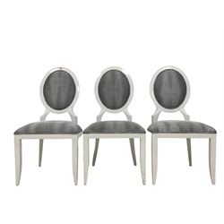 Set six white framed dining chairs, the oval cameo back and seat upholstered in a silver and black snake skin patterned fabric, on tapered supports