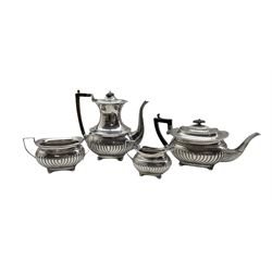 Silver three piece tea set with embossed half body decoration, ebonised handle and lift and on compressed bun feet,  Birmingham 1899 Maker William Hayes, and a matching coffee pot Sheffield 1892 Maker Barraclough & Sons 63.8oz gross