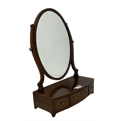 George III mahogany toilet mirror, plain oval plate, crossbanded base fitted with three drawers with ebony stringing