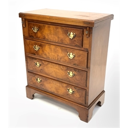 George III style burr walnut bachelors chest, moulded hinged fold over top over three long drawers, raised on shaped bracket supports 