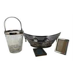 French silver magnifying glass by Boin-Taburet, Paris, small plain silver photograph frame, aperture 8cm x 5.5cm, American sterling silver frame by Gorham, Sheffield plated navette shape bread basket L22cm and a glass and plated ice bucket (5)  Provenance:  From the Estate of the late Dowager Lady St Oswald
