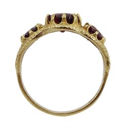 9ct gold three stone oval garnet ring, in an openwork setting, hallmarked