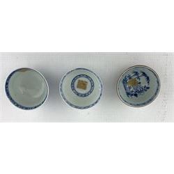 Three Chinese 18th century Nanking Cargo porcelain tea bowls and saucers, all but one bearing Christies lot labels beneath and with certificates 